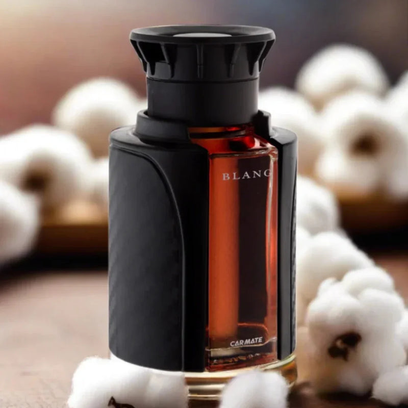 Carmate Blanc car perfume with black holder, amber liquid, surrounded by cotton for fresh auto scent
