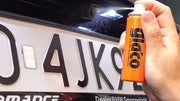 Spraying Glaco Mirror Coat Zero on car rear license plate area
