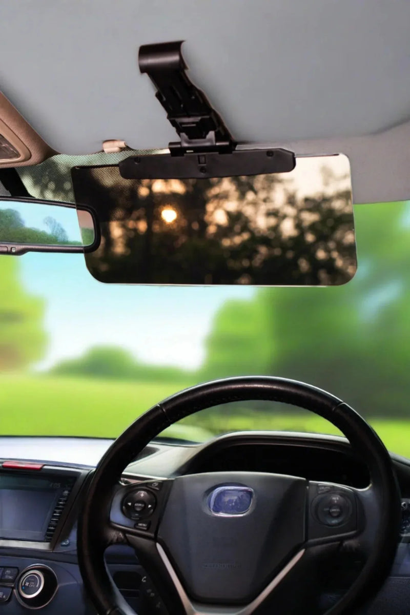 Car sun visor with anti-glare mirror attached, enhancing driver visibility during sunny drives